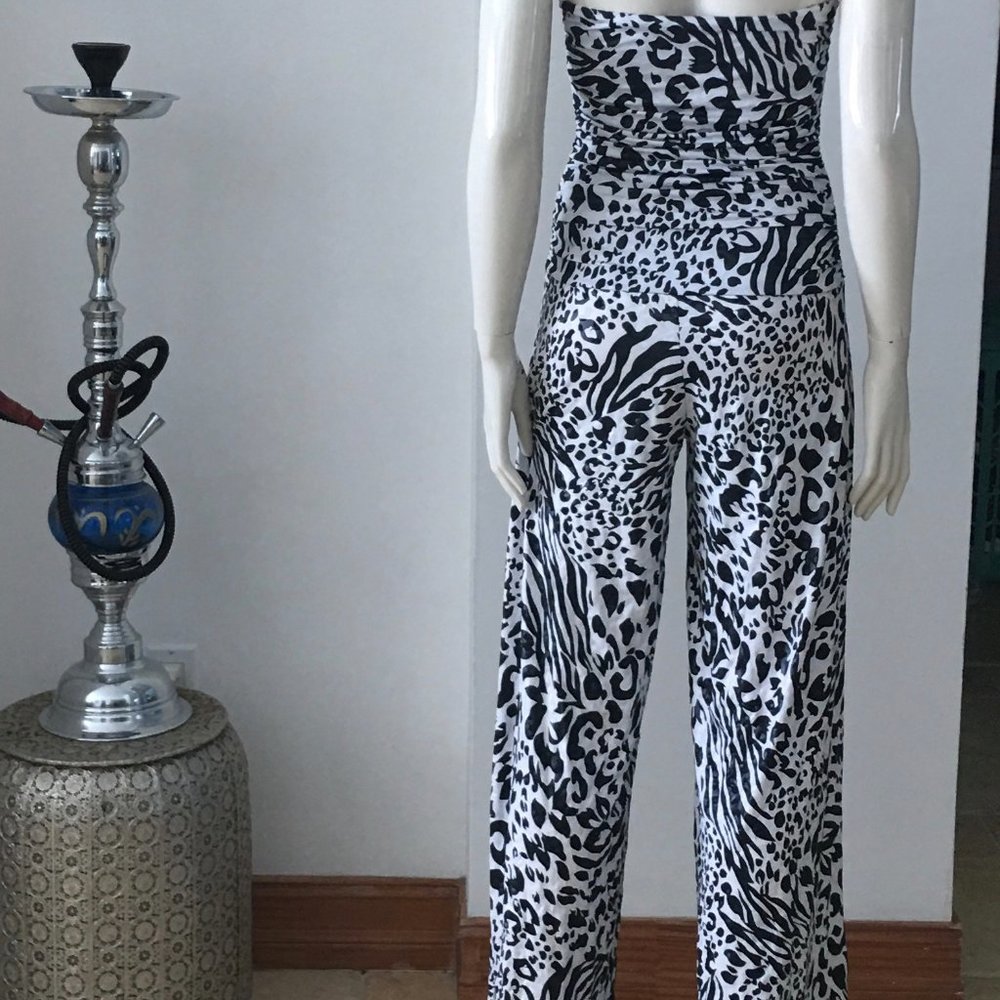 NWOT Strapless jumpsuit with flattering, ruched mid section.